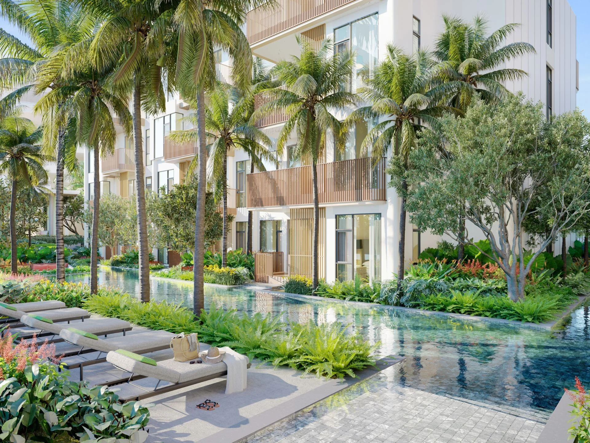 Cour aménagée avec piscine et espace détente aux appartements Canvas, Cheng Talay